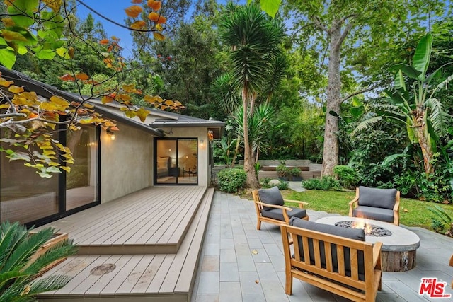 exterior space featuring an outdoor fire pit