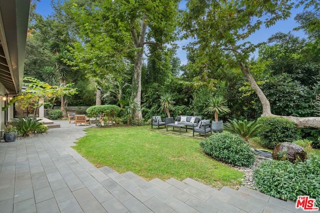 view of yard featuring a patio and an outdoor hangout area