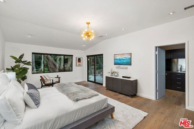 bedroom with access to exterior, light hardwood / wood-style floors, multiple windows, and lofted ceiling