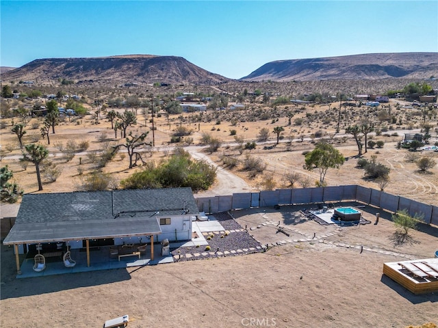 birds eye view of property with a mountain view