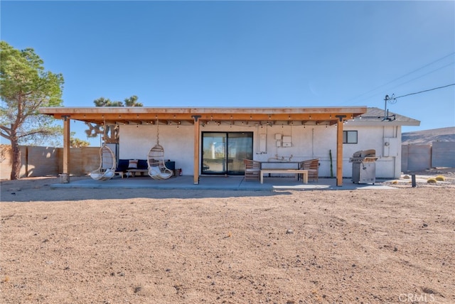 rear view of house with a patio area