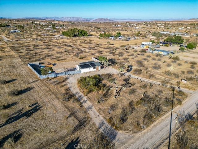 drone / aerial view featuring a rural view and a mountain view