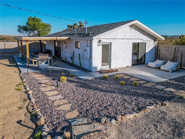 back of house featuring a patio area