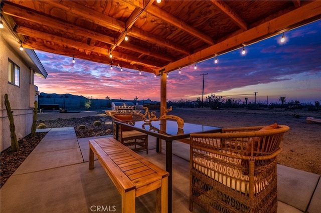 view of patio terrace at dusk