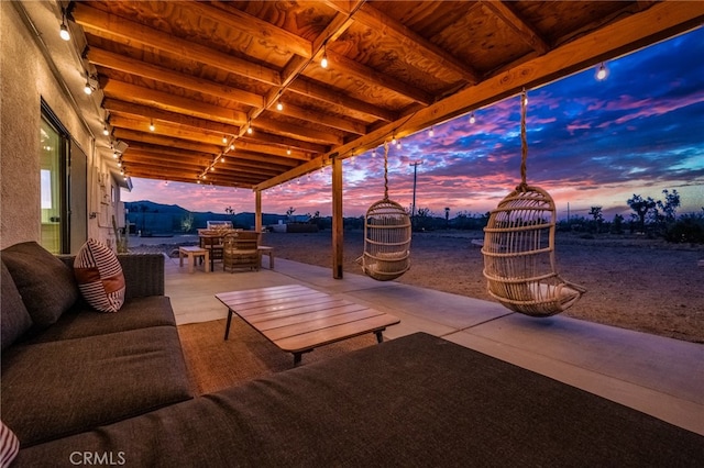 view of patio terrace at dusk