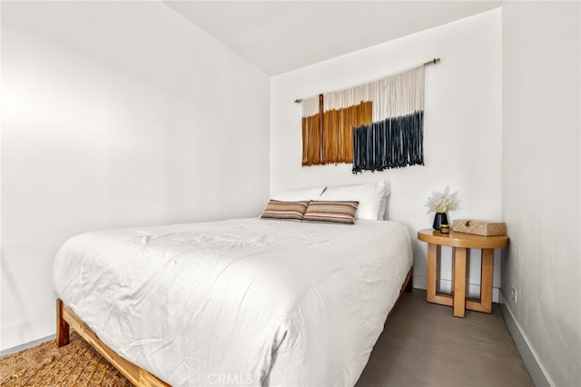 bedroom with hardwood / wood-style floors