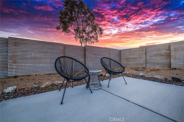 view of patio terrace at dusk