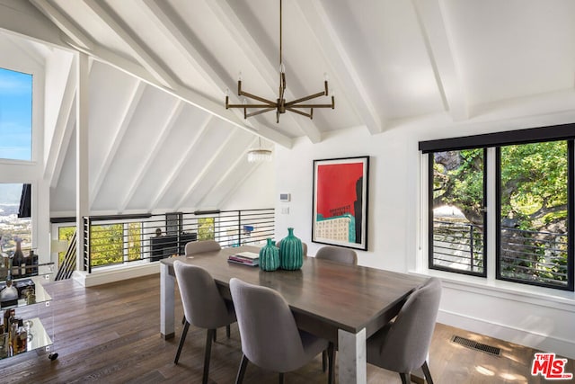 dining room with beamed ceiling, plenty of natural light, and dark hardwood / wood-style floors