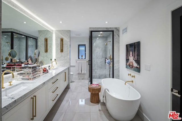 full bathroom with vanity, toilet, tile patterned floors, and shower with separate bathtub