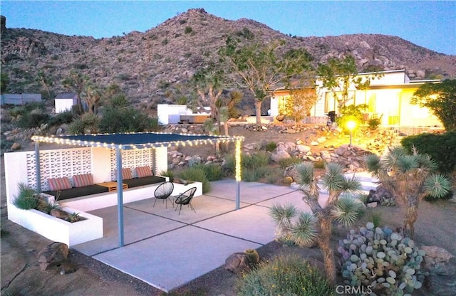 view of patio / terrace with a mountain view