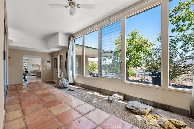 interior space with plenty of natural light and ceiling fan