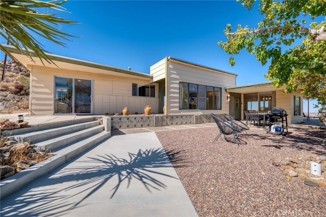 back of property featuring a patio area