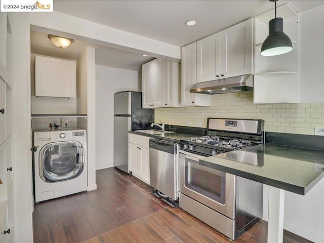 kitchen with washer / clothes dryer, backsplash, white cabinetry, appliances with stainless steel finishes, and dark hardwood / wood-style flooring