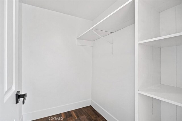 325 W Bush St, Lemoore, CA 93245 - spacious closet featuring dark wood-style floors