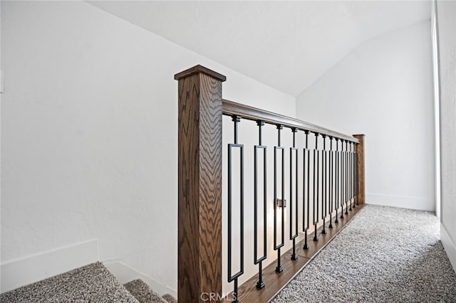 stairs with carpet and vaulted ceiling