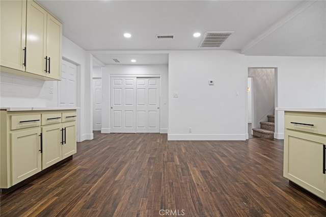 unfurnished living room featuring dark wood-type flooring