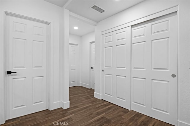 hall with dark hardwood / wood-style flooring