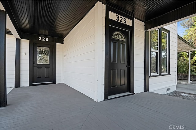 doorway to property with a porch