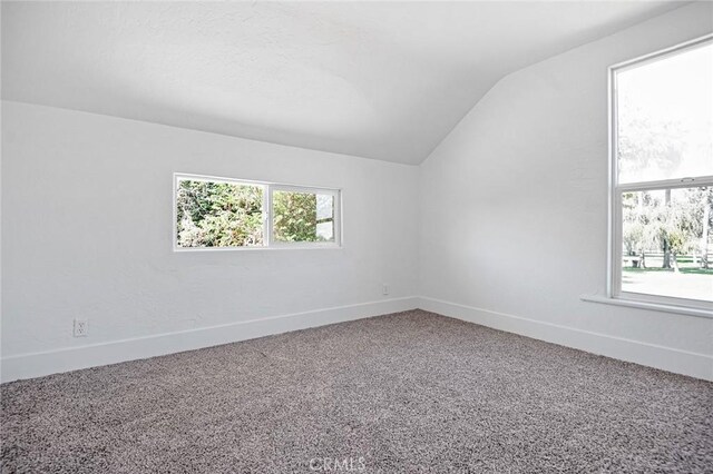 325 W Bush St, Lemoore, CA 93245 - additional living space featuring vaulted ceiling, baseboards, and carpet flooring
