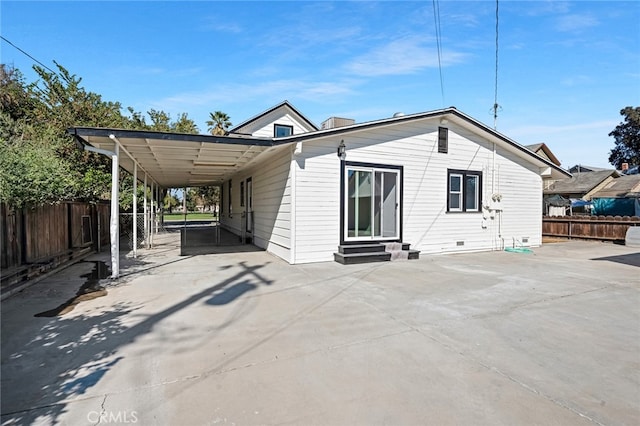 rear view of house with a patio