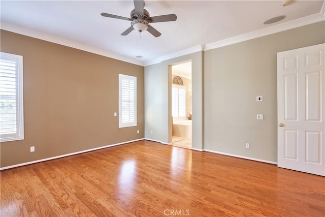 unfurnished room featuring light hardwood / wood-style flooring, ceiling fan, and ornamental molding