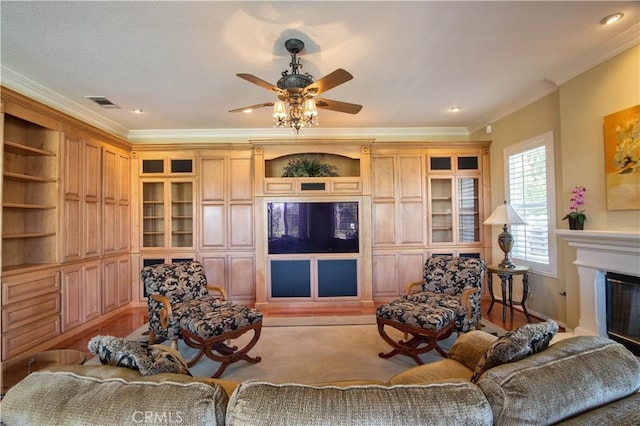 living room with light colored carpet, ceiling fan, and crown molding