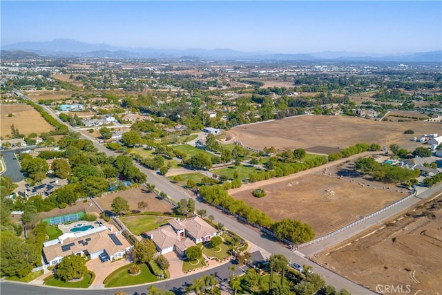 birds eye view of property featuring a mountain view