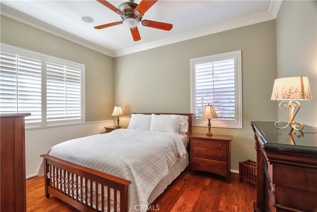 bedroom with ceiling fan, dark hardwood / wood-style flooring, and ornamental molding