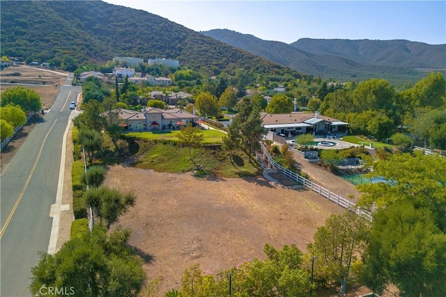 birds eye view of property featuring a mountain view