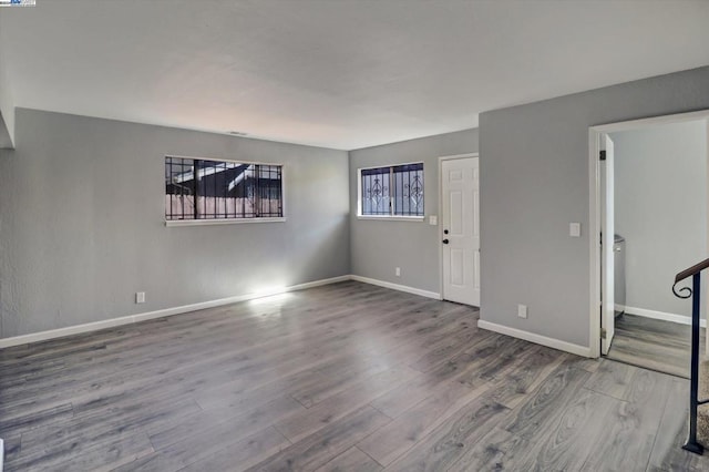 spare room featuring wood-type flooring