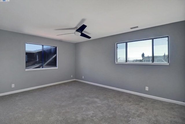 carpeted empty room with ceiling fan