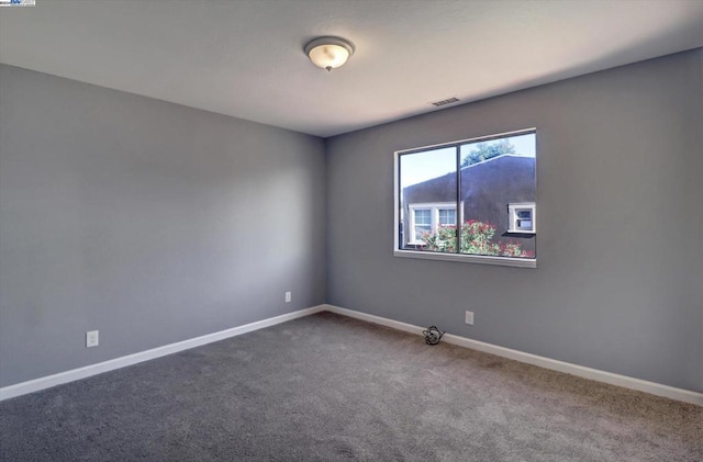 unfurnished room featuring carpet flooring