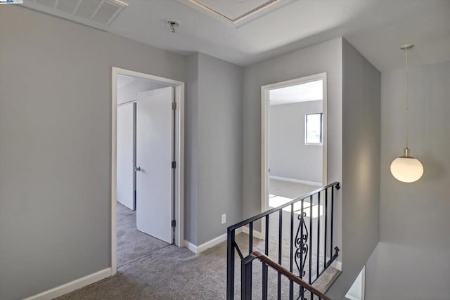 corridor with carpet flooring