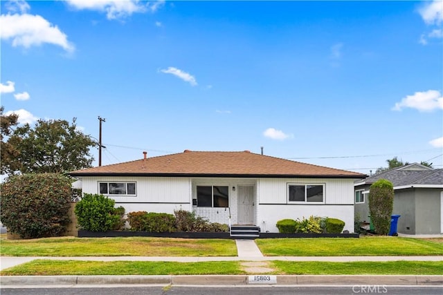 ranch-style house with a front yard