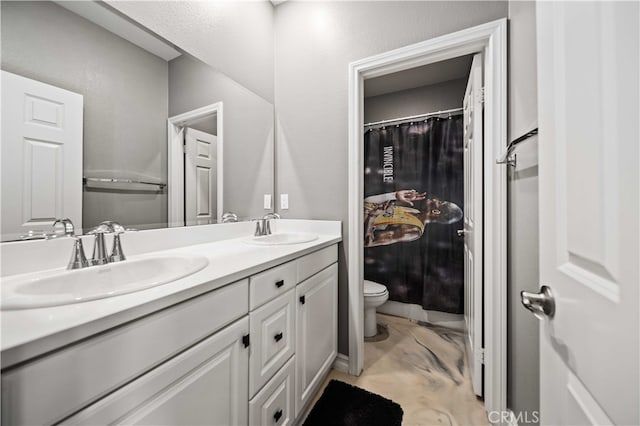 bathroom featuring vanity, toilet, and a shower with curtain