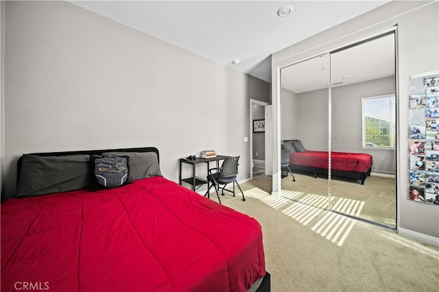 carpeted bedroom featuring a closet