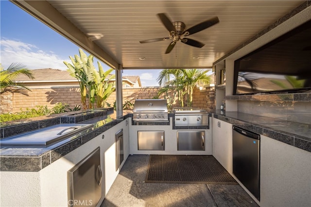 view of patio / terrace with area for grilling, an outdoor kitchen, and ceiling fan