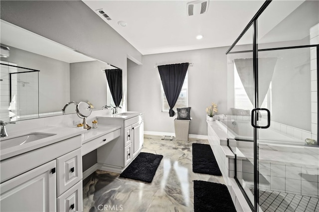 bathroom with vanity and independent shower and bath