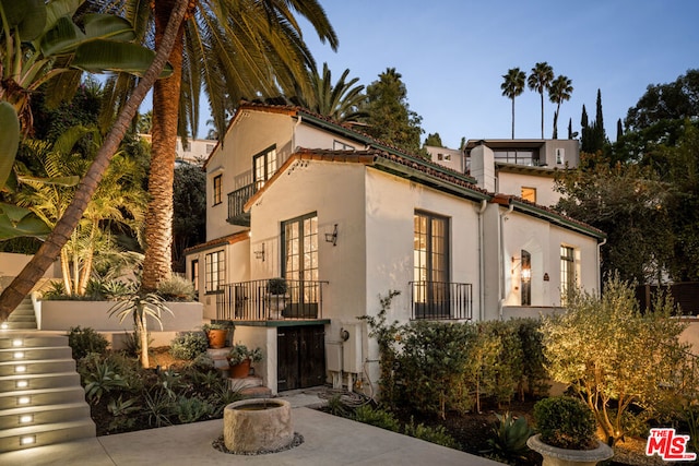 mediterranean / spanish-style home featuring a patio area