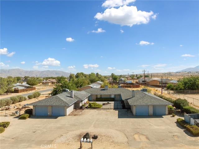 birds eye view of property featuring a mountain view