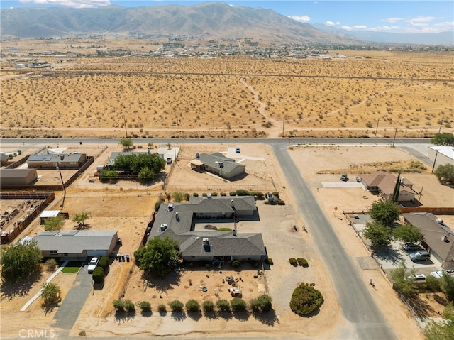 birds eye view of property featuring a mountain view