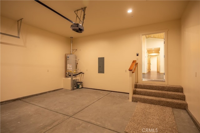 garage featuring a garage door opener, electric panel, and strapped water heater