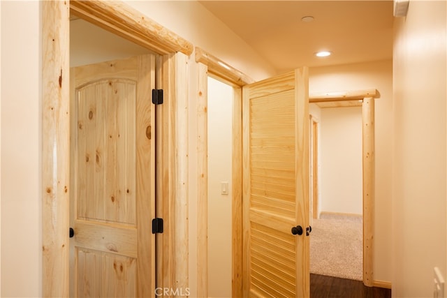 hall with dark hardwood / wood-style floors