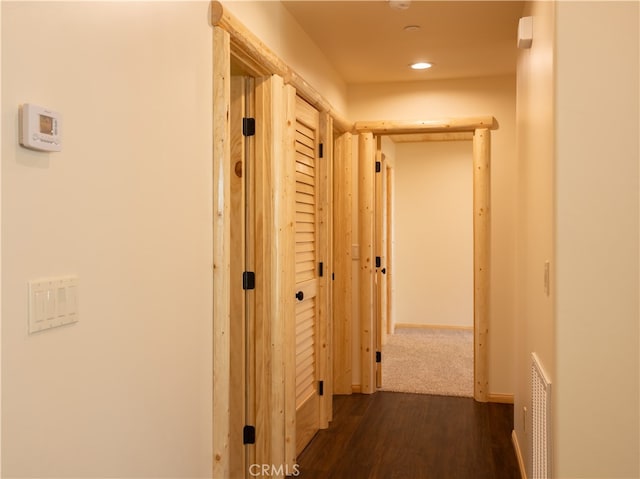 hall featuring dark wood-type flooring