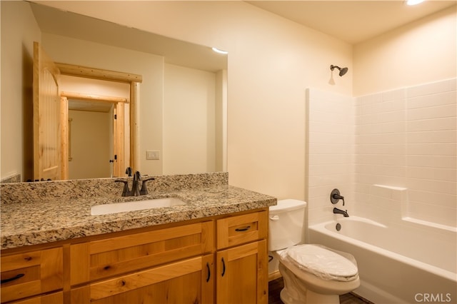 full bathroom with vanity, washtub / shower combination, and toilet