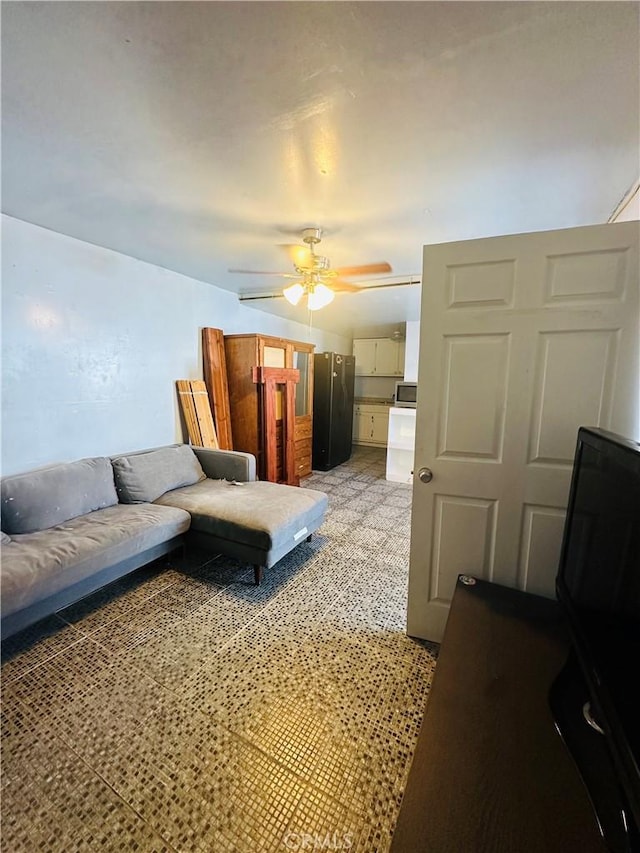 living room featuring ceiling fan