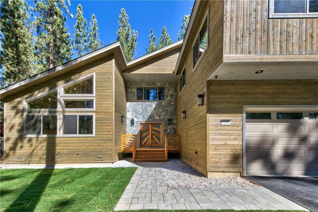 view of exterior entry featuring a garage