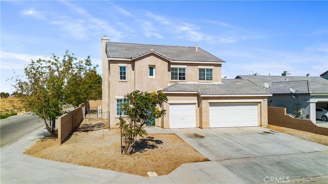 traditional home with fence, a chimney, stucco siding, concrete driveway, and a tile roof