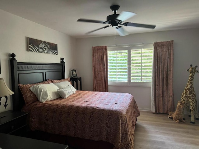 bedroom featuring ceiling fan and light hardwood / wood-style flooring