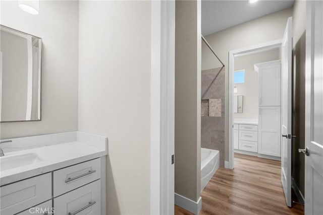 26176 Boulder View Ct, Menifee, CA 92584 - full bathroom with vanity, shower / bath combination, and wood finished floors